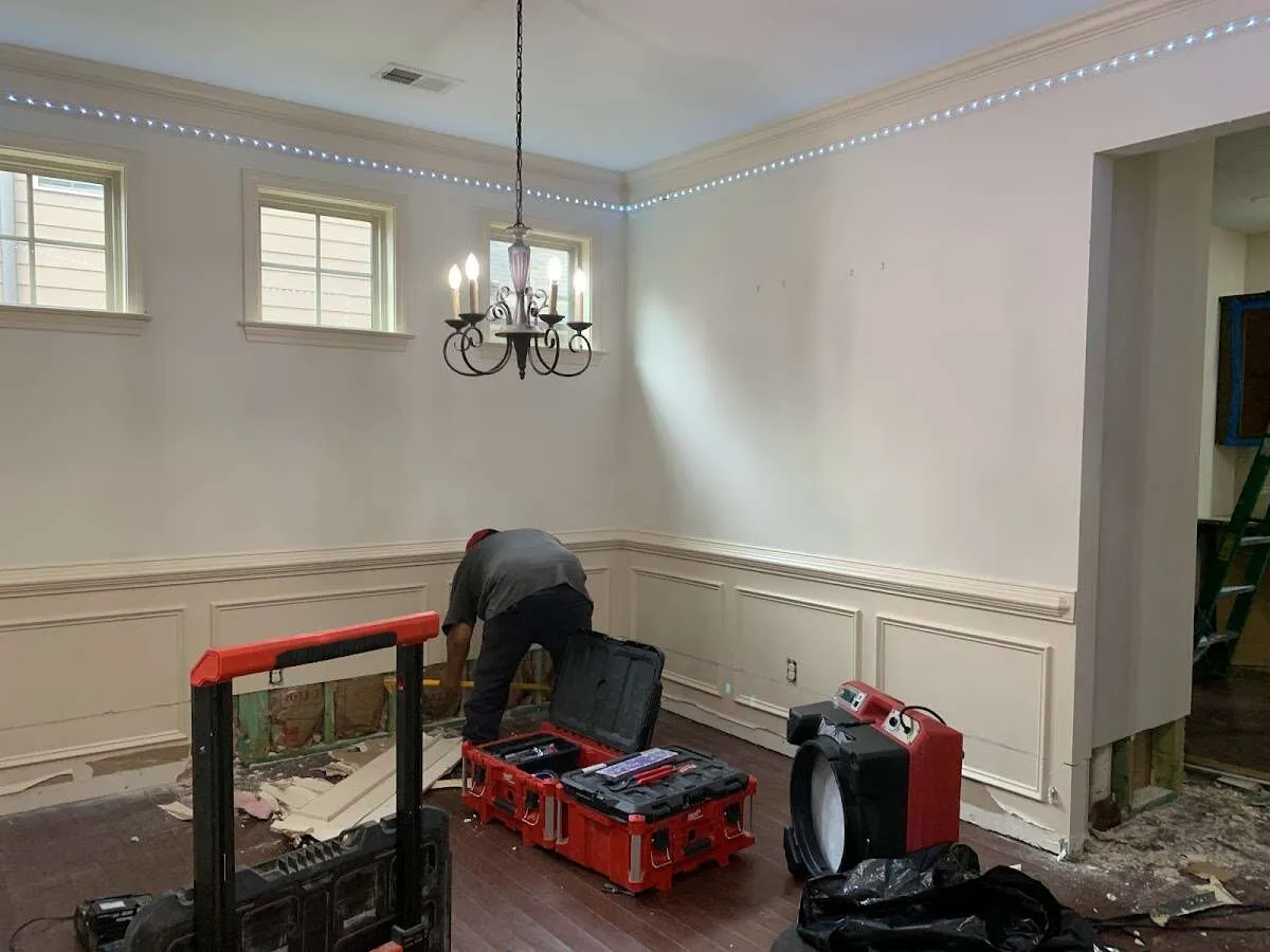 Restoration technician with professional equipment in Oak Grove